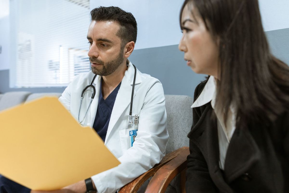 A physician reviewing a care plan with a family member